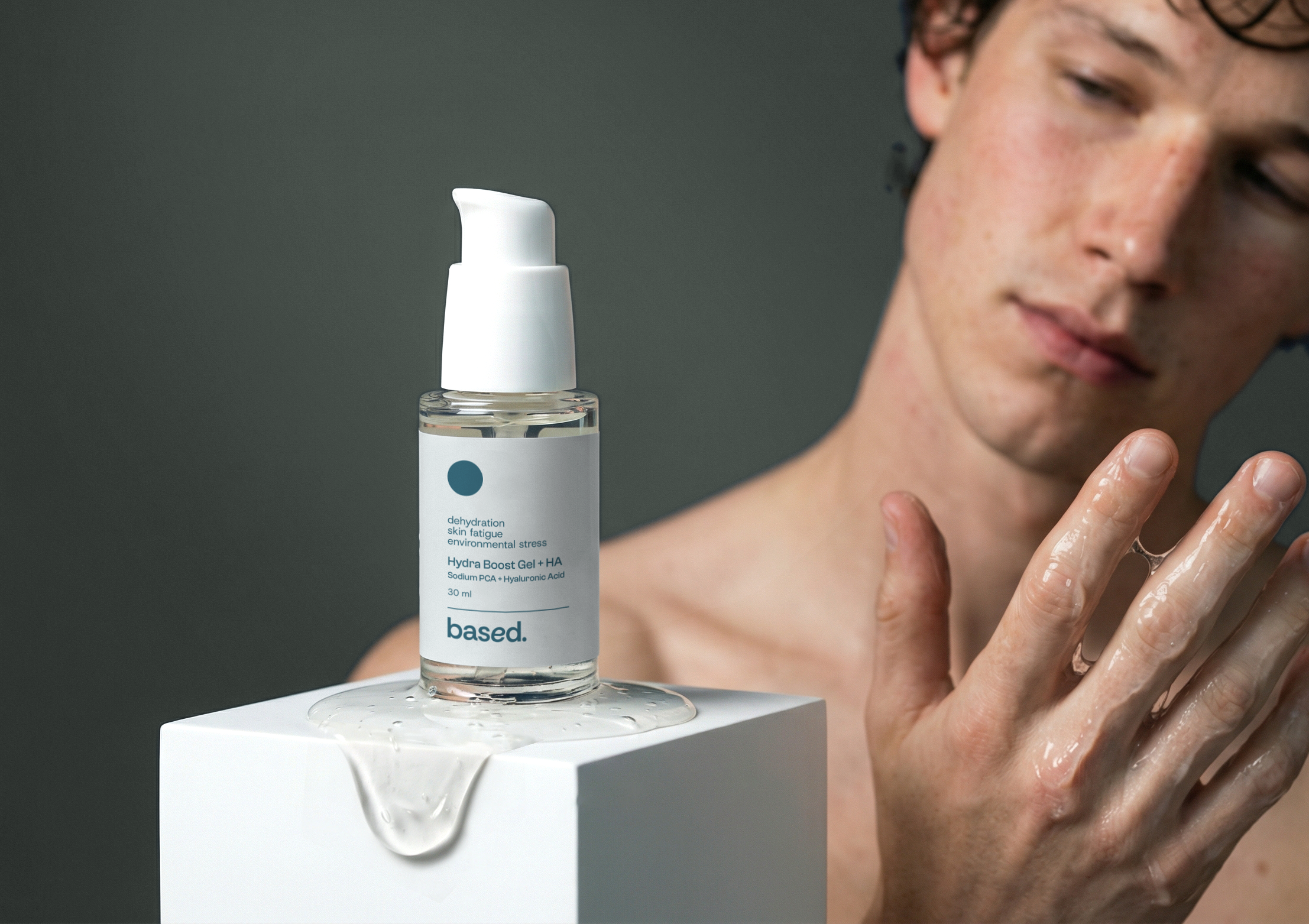 Skincare serum bottle with 'based' branding on a gray background, with a person applying cream.